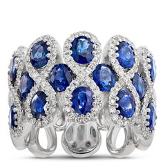 This stunner of a gemstone ring features 14 sapphires surrounded by figure-eight halos of sparkling round diamonds.  The 14k white gold setting is the perfect pairing of precious metal and gemstones because it elegantly complements the deep blue color of the sapphires and light-catching glow of round-cut diamonds. This is truly an heirloom quality piece made to wear and love for a lifetime Blue Diamond Jewelry, Deep Blue Color, Sapphire And Diamond Ring, Diamond Fashion Rings, Precious Metal, Diamond Fashion, Ring Size Guide, Blue Diamond, Round Cut Diamond