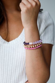 Get ready for a stunning finish to your look, thanks to the Eloise Purple Beaded Bracelet Set! This set of three bracelets is made of pink beads, gold accents + purple beads. Wear them all together, or separately, either way you'll love them! Set Beaded One Size | Diameter 2.5” Sweaters Trendy, Jewelry Dress, Purple Beaded Bracelets, Jewelry Cute, Purple Beads, Cute Rompers, Pink Beads, Dress Jewelry, Trendy Jewelry