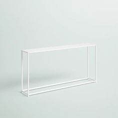 an empty white shelf against a gray background