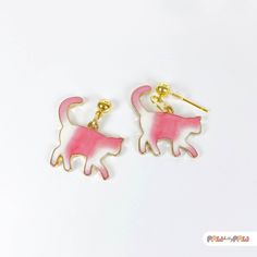 Add a touch of whimsy to your outfit with these adorable Pink Cat Enamel Earrings! Perfect for cat lovers and kawaii enthusiasts alike, these dainty accessories capture the essence of cute and quirky fashion.  🌸✨ Specification ✨🌸 * 18k Gold Plated Earrings * Enamel Charm Size is approx. 2.5 x 2.5 cm Handmade with love, each earring features an irresistibly charming pink cat that's sure to make a statement and bring joy wherever you go. Whether you're looking for a unique gift or a fun addition Cute Cat Design Adjustable Earrings, Adjustable Cute Cat Design Earrings, Cute Adjustable Cat Design Earrings, Pink Cat Design Jewelry With Cat Ears, Pink Cat Design Earrings With Cat Ears Shape, Cute Cat Ears Earrings With Cat Print, Cute White Cat Ears Jewelry, White Cat Design Jewelry With Cat Ears, Novelty White Cat Design Jewelry