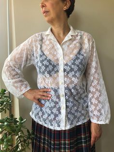 Vintage 50-60ss white semi sheer blouse. Floral pattern white lace blouse. Front buttoned collared blouse. Long sleeve retro style women's clothing. Tender lace blouse. M size. From shoulder to shoulder  18,5" 47cm Bust  39" 99cm Sleeve length  19,5" 50cm Length  25" 64cm. Lace Button-up Blouse With Lace Cuffs, Collared Lace Blouse With Lace Top, White Sheer Long Sleeve Lace Top, Summer Collared Lace Tops, Summer Lace Collared Tops, Collared Lace Tops For Summer, Classic White Top With Lace Sleeves, White Classic Lace Top For Daywear, Classic White Lace Top For Daywear