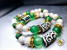 Green and white porcelain African Ghana beads; Gold Tibetan spacers beads; round gold spacer beads; White and Gold Marble Howlite beads White Jade Beaded Bracelets In Bohemian Style, White Large Beads Spiritual Jewelry, White Jade Spiritual Bracelets, White Jade Bracelets For Meditation, White Spiritual Jade Bracelets, Spiritual White Jade Bracelets, Traditional White Beaded Bracelets With Spacer Beads, Handmade White Jade Beaded Bracelets, Handmade White Jade Bracelets