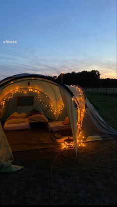 a tent with lights on the inside and outside