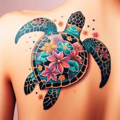 the back of a woman's shoulder with a turtle and flowers on it