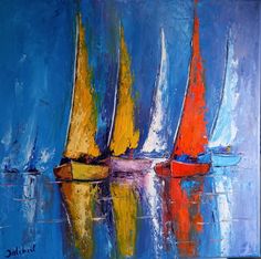 three sailboats are in the water with their sails down and one is red, yellow and blue