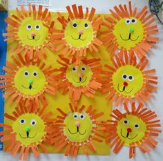 the sun is made out of construction paper and has many faces on it, as well as