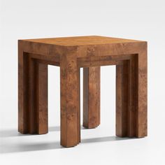 a small wooden table with two legs on each side and one end at the top