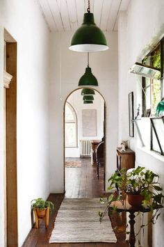 the hallway is clean and ready for guests to use it as an entrance way in the house