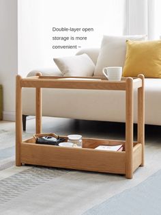 a coffee table with two trays on it in front of a couch and window