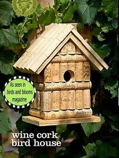 a birdhouse made out of wine corks with the words as seen in birds and blooms magazine