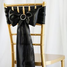 a chair with a black bow tied to it