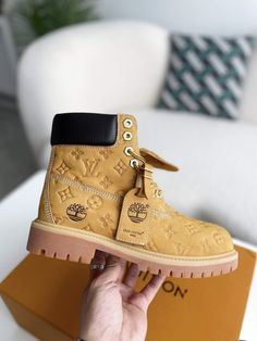 Elevate your style and conquer any terrain with these Timberland-inspired boots, reimagined with the iconic Louis Vuitton monogram. Crafted with premium leather and meticulous attention to detail, these boots offer a unique blend of rugged functionality and high-fashion flair. Step out in confidence and express your individuality with this statement-making footwear. Luxury Ankle Lace-up Boots With Lug Sole, Luxury Lace-up Ankle Boots With Lug Sole, Luxury High-top Lace-up Boots, Luxury Lace-up Boots With Lug Sole, Luxury Ankle Moto Boots With Lug Sole, Luxury High-top Lace-up Boots With Lug Sole, Luxury Lace-up Winter Boots, Luxury Winter Lace-up Boots, Luxury Lace-up Boots For Winter