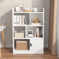 a white book shelf with books and pictures on it