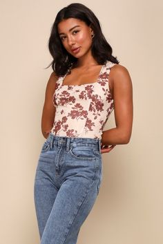 The Lulus Chicly Elevated Beige Floral Print Mesh Sleeveless Bodysuit is ready to help you impress everyone you meet! Stretchy sheer mesh, decorated with a contrasting floral print throughout, shapes this flirty bodysuit that features a sleeveless bodice and a trendy square neckline. The fitted silhouette continues down to attached cheeky bottoms that secure with snap closures. Style with any of your high-waisted favorites for a super cute look! Fit: This garment fits true to size. Length: Size Fitted Sleeveless Bodysuit With Built-in Bra, Fitted Tank Top With Built-in Bra And Square Neck, Fitted Square Neck Tank Top With Built-in Bra, Chic Fitted High Waist Tank Top, Chic Fitted Camisole Bodysuit, Floral Print Fitted Bodysuit, Fitted Floral Print Bodysuit, Fitted Floral Print Top With Tank Straps, Fitted Tank Strap Bodysuit For Spring