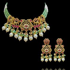 Welcome the festive vibes in all its glory with our dazzling Minahil Set! Elegant set comprised of ruby stones along with elephant and peacock motifs with mint green beads arranged in an exalted design. The set includes a necklace and a pair of earrings. Approximate earrings length is 2.5". Gold-plated on high-quality brass as base metal. Made by order. Kindly allow 5-7 weeks for the delivery of this item. For custom or urgent requests, please contact support@alacouture.com. *Please Note: We use