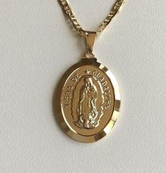 "18K GOLD FILLED GUADALUPE NECKLACE 18\" LONG...FOR GOOD LUCK ,PROSPERITY AND PROTECTION. PENDANT : 25 X 18 mm 18K GOLD FILLED CADENA DE GUADALUPE 18\" LARGO ..PARA PROSPERIDAD, BUENA SUERTE Y PROTECCION. DIJE: 25 X 18 mm" Mary Guadalupe, Guadalupe Necklace, Protection Pendant, For Good Luck, Pompano Beach, Evil Eye Pendant, Fashion Jewelry Necklaces, Virgin Mary, Fashion Watches