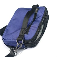 A lovely purple/blue shade with a silvery gray liner. Versatile, fun and cute this lightweight bag features 3 functions in 1. Wear it as a hip pack, crossbody bag or wristlet. Stay hands free and carefree with plenty of room for your wallet, keys, phone and other small everyday necessities. Our strap system is intended to create versatility of use and fit a variety of body types. Includes:-4 zippered compartments -52” strap that fits waist/hip size 39”-61.5” or extend fully for crossbody wear -3 Blue Multifunctional Shoulder Bag For Everyday Use, Blue Multifunctional Bag For Everyday Use, Blue Multifunctional Everyday Bag, Multifunctional Blue Bag For Everyday, Multifunctional Blue Everyday Bag, Purple Travel Shoulder Bag With Zipper Pocket, Versatile Blue Pouch For Everyday Use, Purple School Bag With Cell Phone Pocket, Multifunctional Blue Bags For Everyday Use