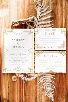 the wedding stationery was done in art deco style, with gold foil and greenery