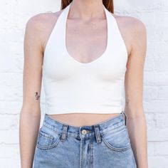 Soft And Stretchy Cotton Halter With A Deep V-Neck Front, A Square-Cut Back And A Cropped Fit. Fabrics: 96% Cotton, 4% Elastane Measurement: 15" (38cm) Length, 12" (31cm) Bust Made In: Europe Nwot Seamless V-neck Crop Top For Day Out, Chic Low-cut Halter Top For Spring, Chic White V-neck Halter Top, Stretch Halter Top With V-neck For Day Out, White Low-cut Top For Summer, White Low-cut Summer Top, White Seamless V-neck Crop Top, Chic White Low-cut Tops, Fitted V-neck Halter Top