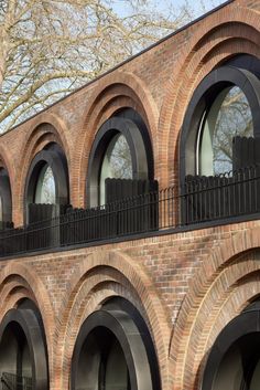 an old brick building with arched windows and balconies