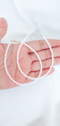 WHITE Pastel Seed Bead ANKLET * white Pastel anklet * Pastel Beaded white anklet * Simple white  anklet * Pastel Aesthetic white anklet Anklet length 8 - 10 inches. For other colors please visit: https://www.etsy.com/uk/listing/993958521/pastel-seed-bead-anklet-select-one This is a minimal pastel anklet, A lightweight & delicate anklet and perfect for everyday wear.  Perfect as Birthday, Christmas and Friendship presents. If you have any questions about these anklets, contact me through the "Ets White Minimalist Beaded Bracelets For Summer, Minimalist White Beaded Bracelets For Summer, Handmade White Anklets For Summer, Minimalist White Beaded Bracelets For Beach, White Beaded Anklets For Summer, White Round Bead Anklets For Summer, White Round Beads Anklet For Summer, White Beaded Anklets With Round Beads, Adjustable White Anklets With Tiny Beads