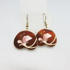 These fun Cloisonne' Enamel Earrings are done in goldtone metal with a white and pink flower against a rich brown background. The earrings are French hook style and are in near mint condition.  They are not marked. They measure 1 5/8ths inches tall and 1 1/8ths inches wide.  We will send these to you in a lovely gift box for easy gift giving If you like vintage accessories, vintage costume jewelry, old bolo ties and silver jewelry,  please see my Etsy store for more selections, www.etsy.com/shop Vintage Brown Drop Earrings, Brown Drop Flower Earrings For Gift, Brown Flower Drop Earrings For Gift, Vintage Brown Flower-shaped Jewelry, Retro Flower-shaped Earrings For Gift, Retro Flower Shaped Earrings For Gift, Retro Flower Shape Earrings For Gift, Retro Flower Shaped Earrings As Gift, Brown Flower-shaped Earrings For Gift