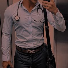 a man with a stethoscope on taking a selfie