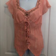 Peach Colored Very Unique Top With Lace Up Detail Down The Front Fitted Embellished Tops For Beach, Fitted Embellished Blouse, Feminine Embellished Summer Tops, Embellished Feminine Summer Tops, Elegant Embellished Tops For The Beach, Elegant Embellished Top For Beach, Casual Fitted Embellished Blouse, Unique Top, Pretty Blouses