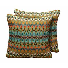 two decorative pillows with colorful patterns on the front and back, one in blue and green