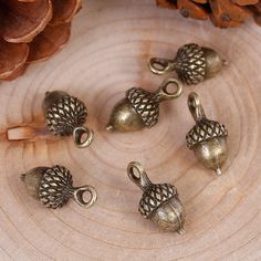 These adorable bronze tone charms are made from zinc alloy metal and are lead and nickel free. They're perfect for crafting necklaces, bracelets, earrings, bookmarks, key chains and more! ♥ Antique Bronze Tone Acorn Charms ♥ Material: Zinc Alloy Metal ♥ Size: 18 x 9mm ♥ Includes: 4 pieces We ship on the next business day from North Carolina via USPS. Tracking is included with all orders. Get free shipping on orders over 35! Don't forget to favorite us too, we add items daily. Thank you... craft Oak Acorn, Acorn Jewelry, Tree Charms, Acorn Pendant, Fruit Jewelry, Beads Charms, Handmade Copper, Leaf Pendant, Diy Charms