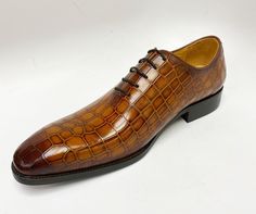 Style: 503-67E-Cognac Unique Crocodile Printed Embossed Calfskin lace-up Oxford from our Carrucci by Maurice collection features soft Calfskin lining, a clean welt, and a Rubber Sole! Lace-up Leather Shoes With Crocodile Pattern, Brown Oxfords With Crocodile Pattern And Round Toe, Formal Lace-up Leather Shoes With Crocodile Pattern, Luxury Lace-up Leather Shoes With Crocodile Pattern, Luxury Crocodile Pattern Leather Lace-up Shoes, Luxury Crocodile Pattern Lace-up Leather Shoes, Classic Brown Oxfords With Crocodile Pattern, Fitted Oxfords With Crocodile Pattern For Business, Brown Crocodile Pattern Oxfords For Formal Occasions