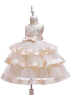 Silhouette Princess Neckline Jewel Hemline/Train Knee-Length Back Details Zipper Fabric Tulle, Polyester Cotton Embellishment Bows, Flowers Sleeve Length Sleeveless Fully Lined Yes Season Spring, Summer, Fall Weight 0.3kg Sleeveless Ruffled Princess Dress For Wedding, Gold Sleeveless Princess Dress For Dress-up, Princess Style Sleeveless Dress With Ruffles, Elegant Sleeveless Lace Princess Dress, Fitted Princess Sleeveless Dress With Ruffles, Elegant Sleeveless Tulle Dress For Dress-up, Fitted Sleeveless Princess Dress With Ruffles, Princess Style Cream Summer Dress, Princess Style Cream Sleeveless Dress