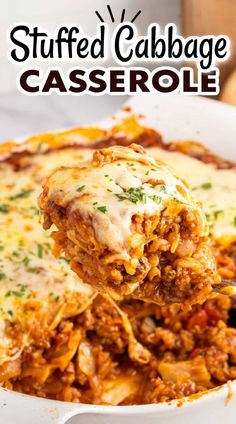 a spoonful of stuffed cabbage casserole is being lifted from the casserole dish