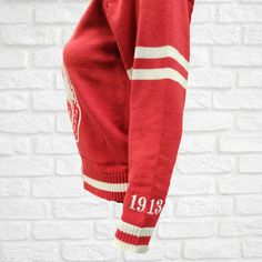 Our V-Neck Varsity Sweater is the perfect addition to any outfit. It features DST sorority crest. This Red and White sweater is perfect for looking and feeling your best! Red And White Sweater, Delta Sigma Theta Sorority, Varsity Sweater, Delta Sigma Theta, Chenille Sweater, White Sweater, Red Fabric, White Sweaters, Red Sweaters