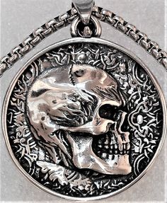 Double Sided Skull Pendant with 23 inch Necklace, Can be worn on either side of designs. One Double Faced Pendant 1.25 inches and One 23 inch chain comes with your order. Collectible Silver Skull Necklace, Symbolic Skull Jewelry With Oxidized Finish, Nickel-free Stainless Steel Skull Necklace, Skull-shaped Engraved Stainless Steel Necklace, Skull Shaped Engraved Stainless Steel Necklace, Engraved Skull Necklace In Stainless Steel, Hollywood Fl, Urn Necklace, Gothic Necklace