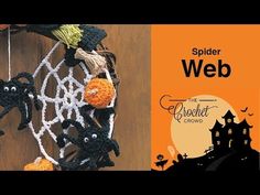 there is a crocheted halloween decoration hanging on the wall next to an advertisement for spider web