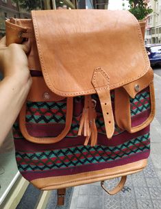 "Welcome! Amazing Vintage Leather and fabric Backpack In very good condition, i think never use A lot of pockets Measures: H: 14.56\" (37 cm) W: 13.77\" (35 cm) Deep: 3.54\" (9 cm) Thanks for stopping by!!IMPORTANT: Due to the delicate situation We're all going through, and in order to keep the safety of courier workers too, all orders will be dispatched when alert sanitary finished. You can purchased or reserve items like always. Thanks so much for your understanding." Leather Trim Shoulder Backpack For Daily Use, Daily Use Backpack With Leather Trim, Leather Backpack With Flap For Travel, Leather Flap Backpack For Travel, Leather Trim Satchel Backpack For Daily Use, Leather Shoulder Backpack With Leather Trim, Casual Travel Satchel With Leather Backing, Leather Trim Flap Shoulder Bag For Travel, Casual Brown Leather Backpack With Luggage Sleeve