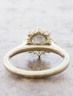 an antique diamond ring is sitting on the ground