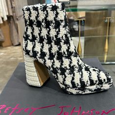 Step Out In Style This Season In The Raylan Houndstooth Platform Bootie! These Comfy Booties Feature A Classic Houndstooth Print That'll Always Be In Style. With The Added Platform For A Little Extra Height, You'll Be Strutting Around Town In Style! Textile Plaid Upper Material Synthetic Lining/Sock Synthetic Sole 4 Inch Heel Height 1 Inch Platform Imported Chic White Boots For Party, Glamorous White Boots For Spring, Chic White Party Boots, Glamorous White Spring Boots, White Block Heel Boots For Evening, Evening White Block Heel Boots, Trendy White Evening Boots, Aztec Boots, Plaid Heels