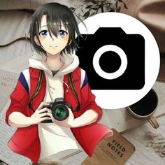 a girl holding a camera in front of a book