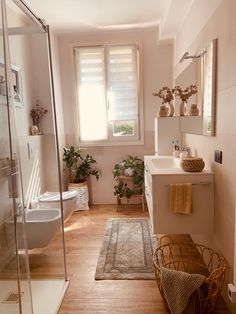 a bathroom with a sink, toilet and shower in it's own home setting