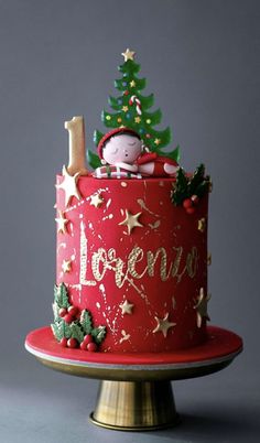 a red christmas cake decorated with stars and trees