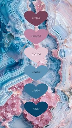 three hearts are on top of a blue and pink marble background with the words love in different colors