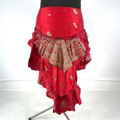 Luna Steampunk Over Skirt, Bustle skirt, tribal mini skirt, fashioned from vintage silk brocade.  This tail skirt is a great addition to all sorts of outfits.  Easily add an extra, colourful layer over leggings, tights, skirts or shorts. Wear at the back or side. The skirt is adjustable in fitting. It has 2 silk ties which are attached to two strong brass hoops for added style and functionality. Strong stitching, pleating and layers of ruched fabric on the tail makes this an eternally stunning p Bohemian Skirt For Cosplay, Red Mini Skirt For Alternative Fashion, Gothic Asymmetrical Skirt For Festivals, Red Mini Skirt For Cosplay, Gothic Mini Skirt For Festival, Bohemian Ruffled Skirt For Party, Gothic Style Fitted Red Mini Skirt, Summer Bohemian Skirt For Costume Party, Red Punk Style Skirt For Party