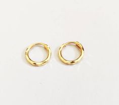 22k gold Tiny hoop, Tragus Gold hoop,Cartilage Hoop,Helix Hoop, Conch Gold Hoop,Tiny Huggie Hoop, Tiny Nose Hoop, Daith Hoop, Solid Gold Handmade tiny hoop in solid 22k gold, diamond cut hoop, Hallmarked and tested in indian Lab. Pure and genuine Gold Minimal hoop. Metal: 22k hallmark Gold Size inside: 6.5mm Size outside: 9mm Wire thickness: 0.7mm Specially made for tragus, cartilage, daith, conch, nose tiny hoop,. We welcome custom orders as well. All our Jewellery is made with love and care in Yellow Gold Huggie Nose Ring Gift, Dainty Yellow Gold Huggie Nose Ring, Dainty Yellow Gold Small Hoop Cartilage Earrings, Handmade Yellow Gold Round Huggie Earrings, Gold Small Hoop Nose Rings For Everyday, 14k Gold Hoop Cartilage Earrings, Gold 14k Huggie Nose Rings, Dainty Gold Hoop Cartilage Earrings, Everyday Gold Huggie Nose Rings