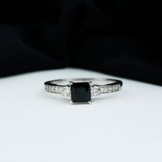 a black and white diamond engagement ring