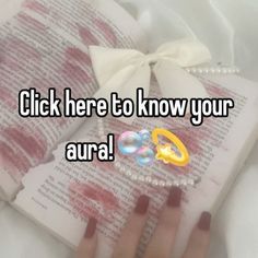 someone is reading a book with the words click here to know your aura