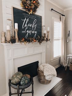 a living room with a fire place and a chalkboard sign on the fireplace mantel