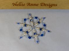 a beaded snowflake with blue and white beads