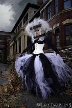 a woman in a black and white costume